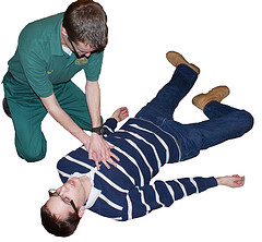 one man performing cpr on another