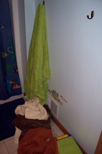 floortowels3 towel hanging, still one on floor