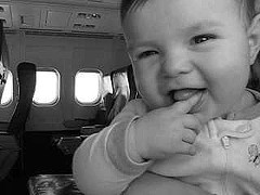 smiling baby in airplane