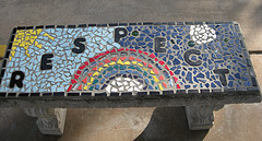 bench with rainbow and the word respect tiled on it