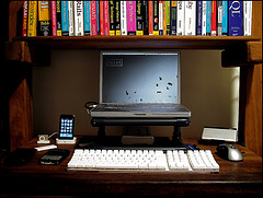laptop computer sitting behind separate keyboard on desk