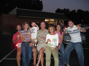 family posing together holding ice cream