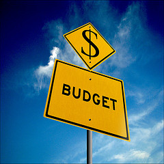 yellow sign saying budget with dollar sign above