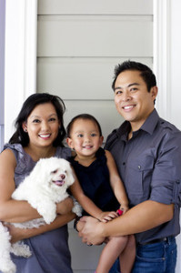 Mother, father, and child with dog