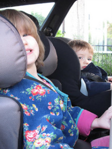 toddlers in car seats in car